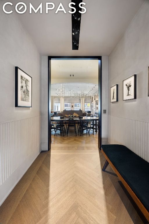 corridor featuring parquet flooring