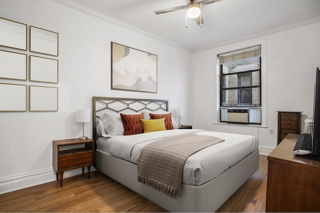 bedroom with ornamental molding, ceiling fan, baseboards, and wood finished floors