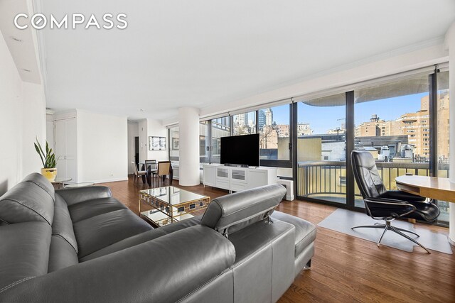 167 E 61st St Unit 7D, New York City, NY 10065 - living area featuring wood finished floors