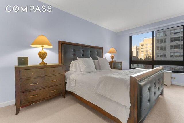 167 E 61st St Unit 7D, New York City, NY 10065 - bedroom with light colored carpet and baseboards