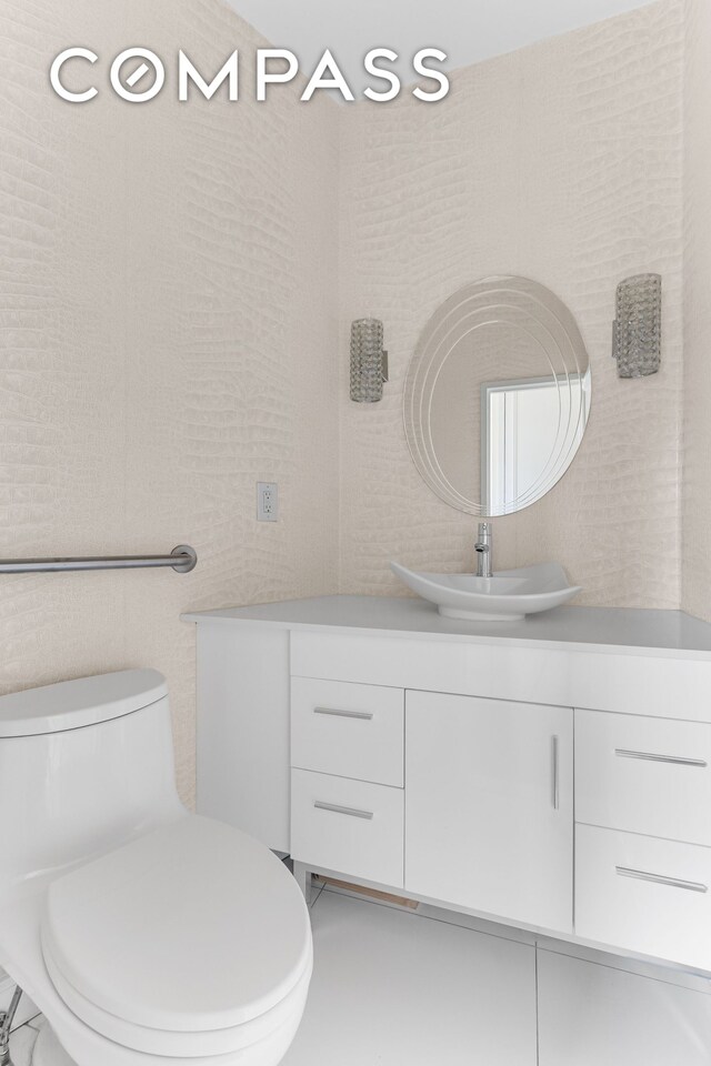 167 E 61st St Unit 7D, New York City, NY 10065 - bathroom featuring vanity and toilet