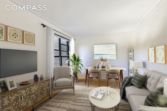 living room featuring baseboards, crown molding, and wood finished floors