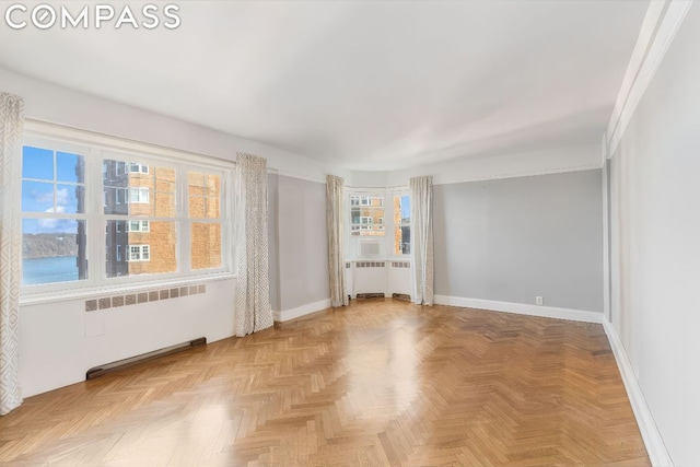 interior space featuring parquet flooring and radiator