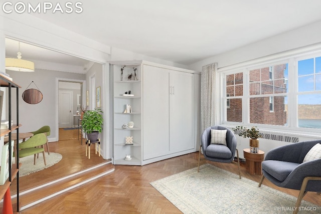 living area featuring parquet floors