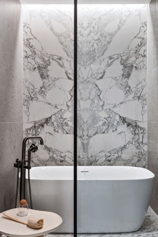 bathroom with a tub to relax in