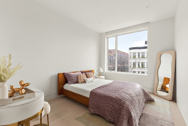 bedroom with light hardwood / wood-style flooring