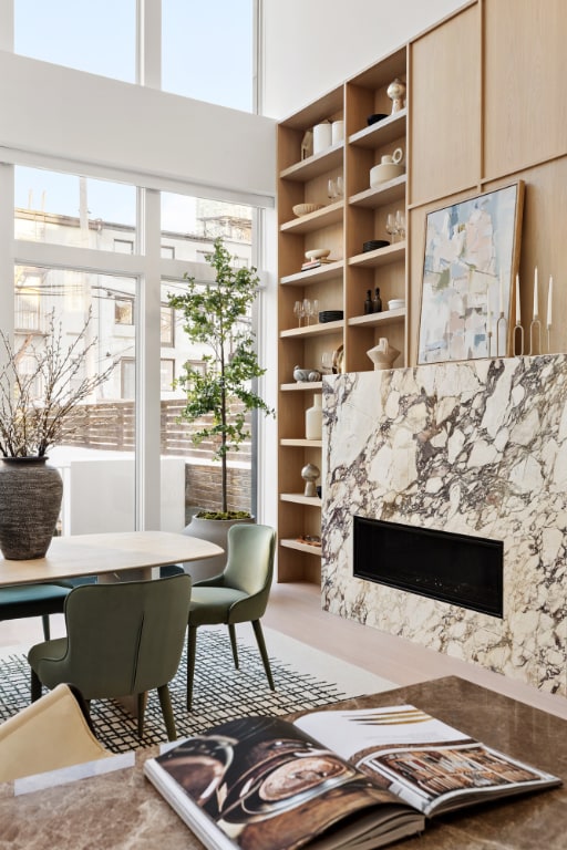 living room with built in features and a fireplace