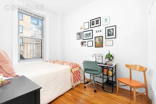 bedroom with wood finished floors