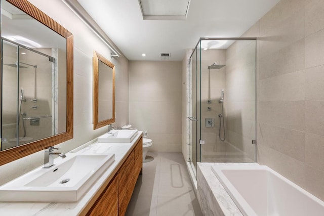 full bathroom with toilet, vanity, separate shower and tub, and tile patterned flooring