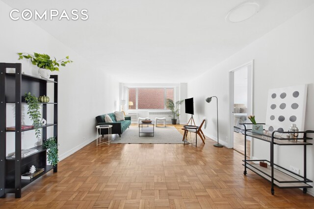 living area featuring light parquet floors