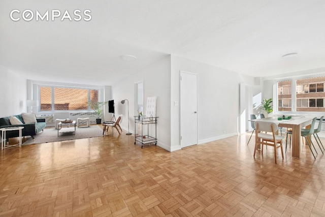 dining space with light parquet floors