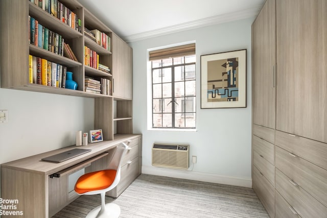 office featuring an AC wall unit, crown molding, and built in desk