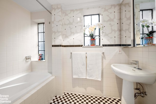 bathroom with tiled bath and tile walls