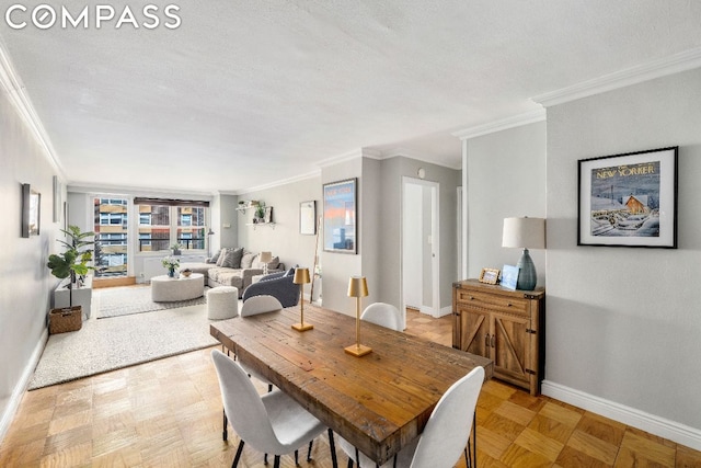 dining space with light parquet flooring, crown molding, and a textured ceiling