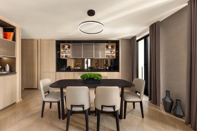 dining space featuring light parquet floors