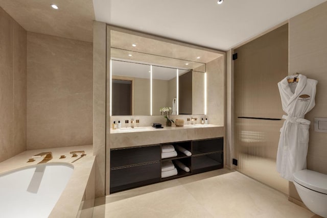 bathroom featuring toilet, vanity, and tile patterned flooring