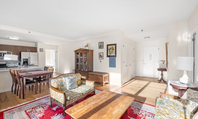 living room featuring sink and light wood-type flooring