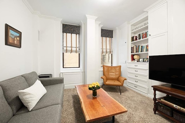 living room featuring ornamental molding and carpet flooring