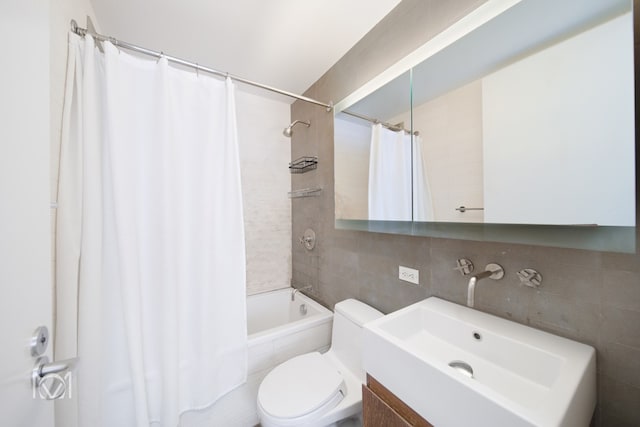 bathroom featuring shower / tub combo with curtain, tile walls, backsplash, toilet, and vanity