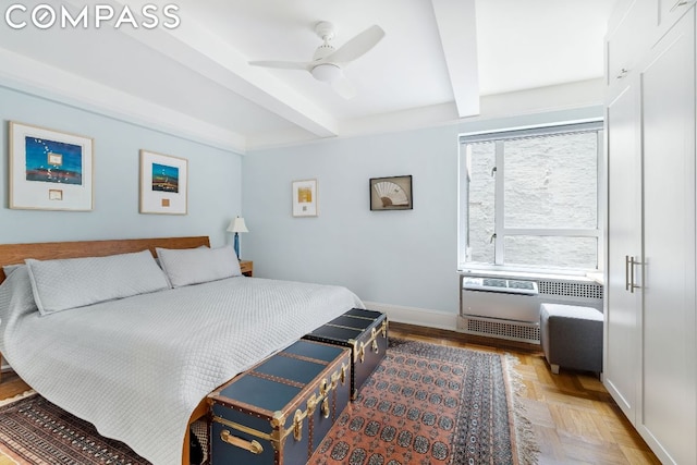 bedroom with ceiling fan, parquet floors, and beamed ceiling