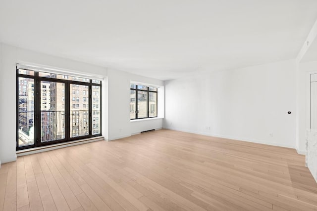 empty room featuring light hardwood / wood-style floors