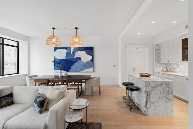 living room with light hardwood / wood-style floors