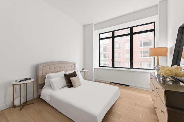 bedroom featuring light hardwood / wood-style flooring