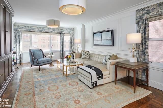 living room with crown molding and parquet floors