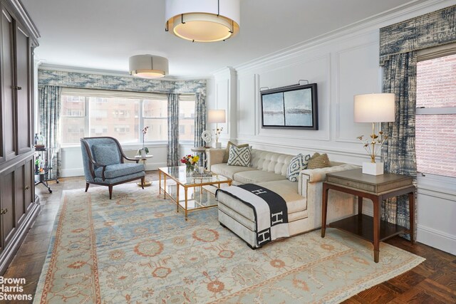 living room featuring parquet floors and ornamental molding