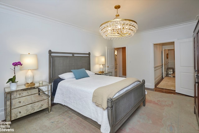 bedroom featuring ornamental molding and an inviting chandelier