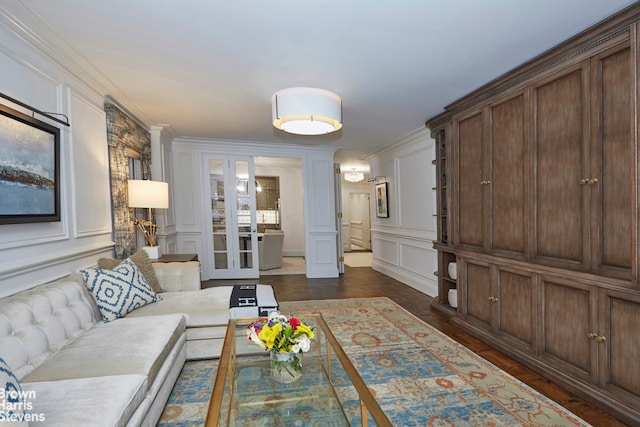 living room featuring ornamental molding and dark hardwood / wood-style floors