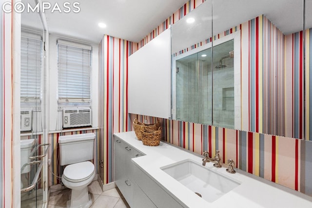 bathroom with cooling unit, tile patterned floors, vanity, a shower, and toilet