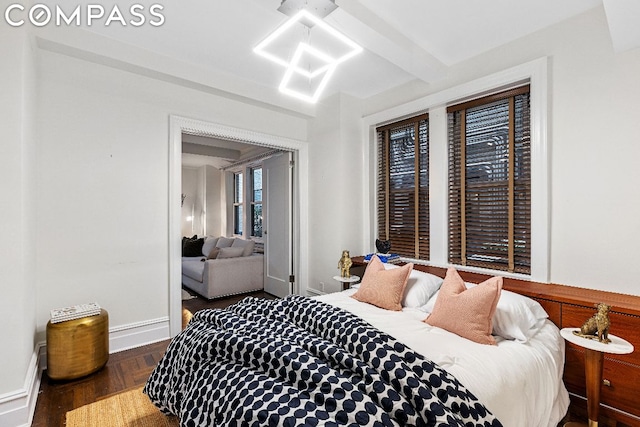 bedroom with dark parquet flooring