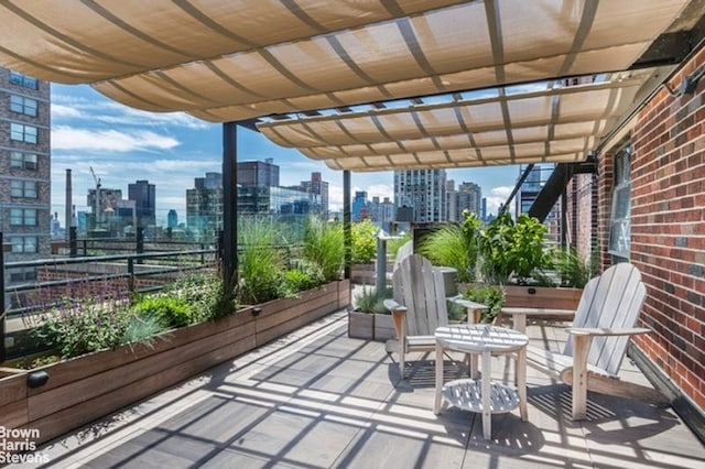 view of patio featuring a pergola