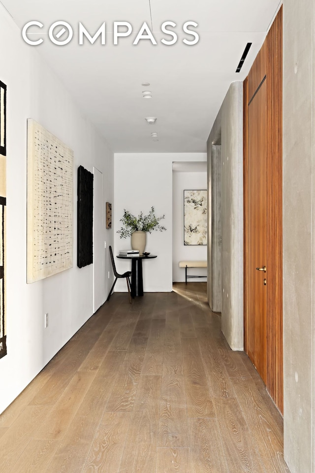 hallway with wood finished floors