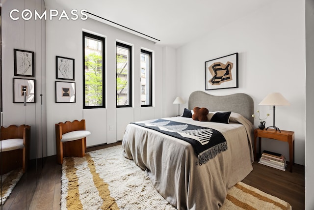 bedroom with wood finished floors