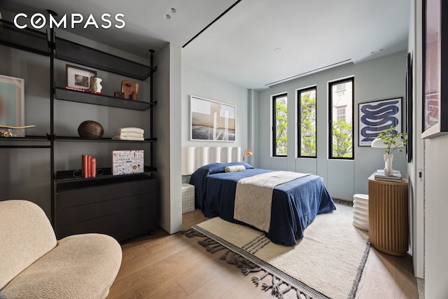 bedroom featuring wood finished floors