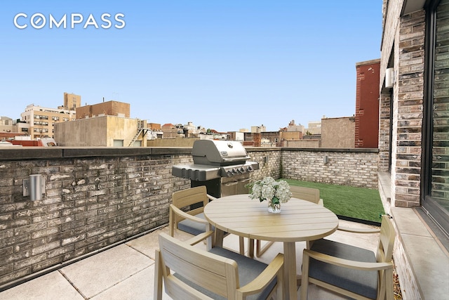 211 E 13th St Unit Ph1B, New York City, NY 10003 - view of patio featuring outdoor dining area and a grill