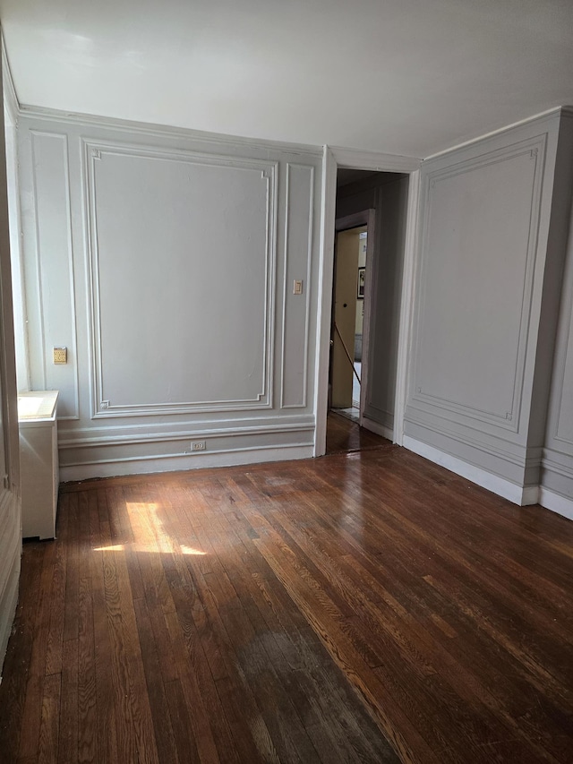 924 Summit Ave Unit 1B, New York City, NY 10452 - unfurnished bedroom with wood finished floors and a decorative wall