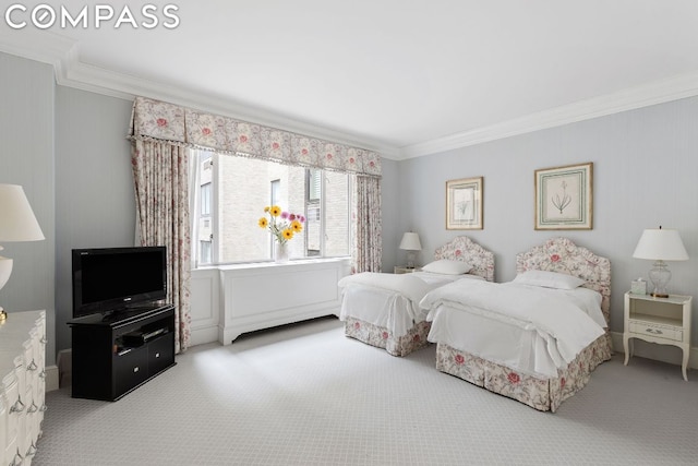 carpeted bedroom featuring ornamental molding