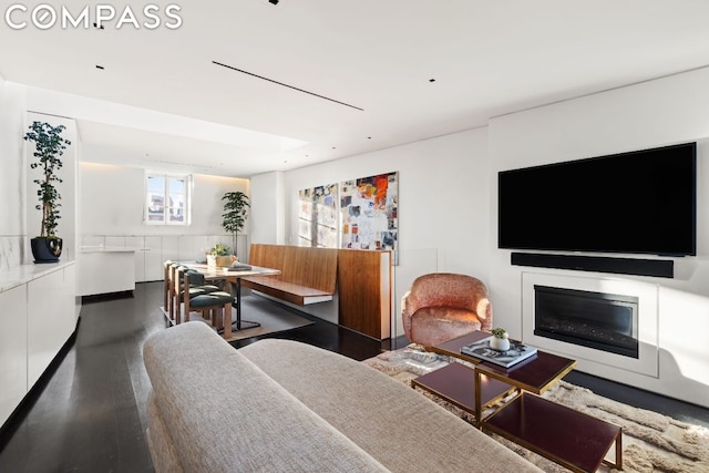 living room with dark hardwood / wood-style flooring