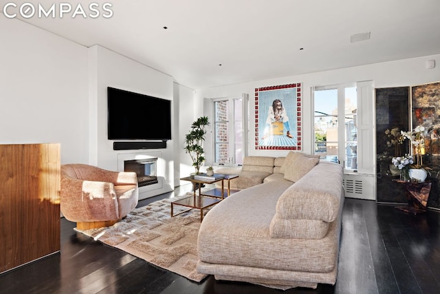 living room with dark hardwood / wood-style floors