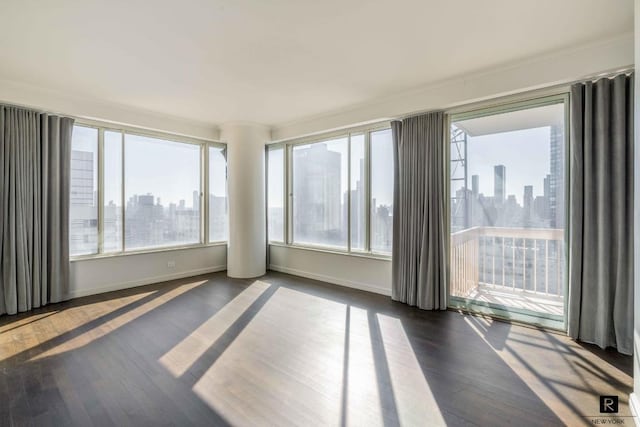 spare room with dark hardwood / wood-style flooring