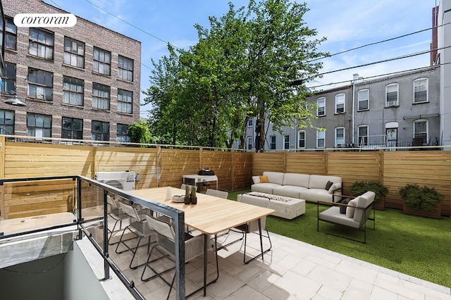 view of patio / terrace featuring an outdoor living space with a fire pit