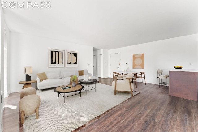 living room with dark wood-type flooring