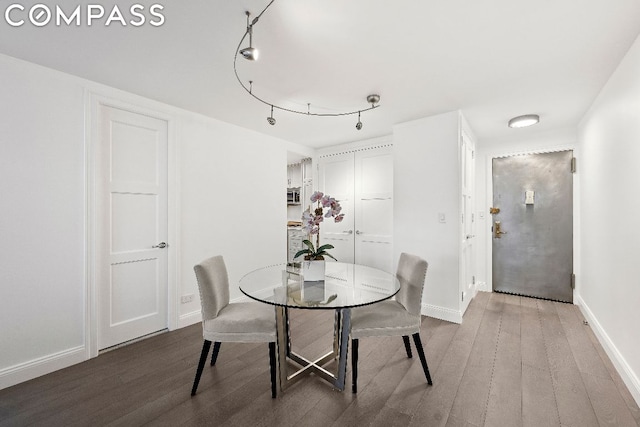 dining area with hardwood / wood-style floors