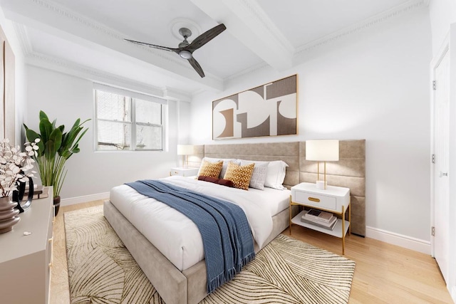 bedroom featuring ceiling fan, crown molding, beamed ceiling, and light wood-type flooring