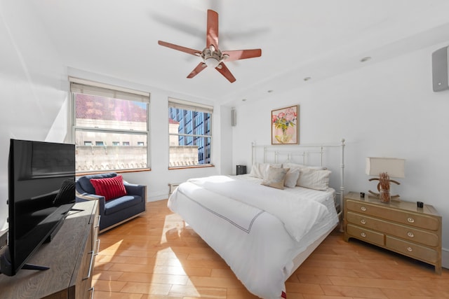 bedroom featuring light wood-type flooring and ceiling fan