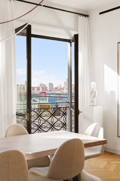 dining room featuring parquet floors