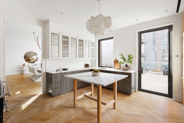 dining area with light parquet flooring and sink